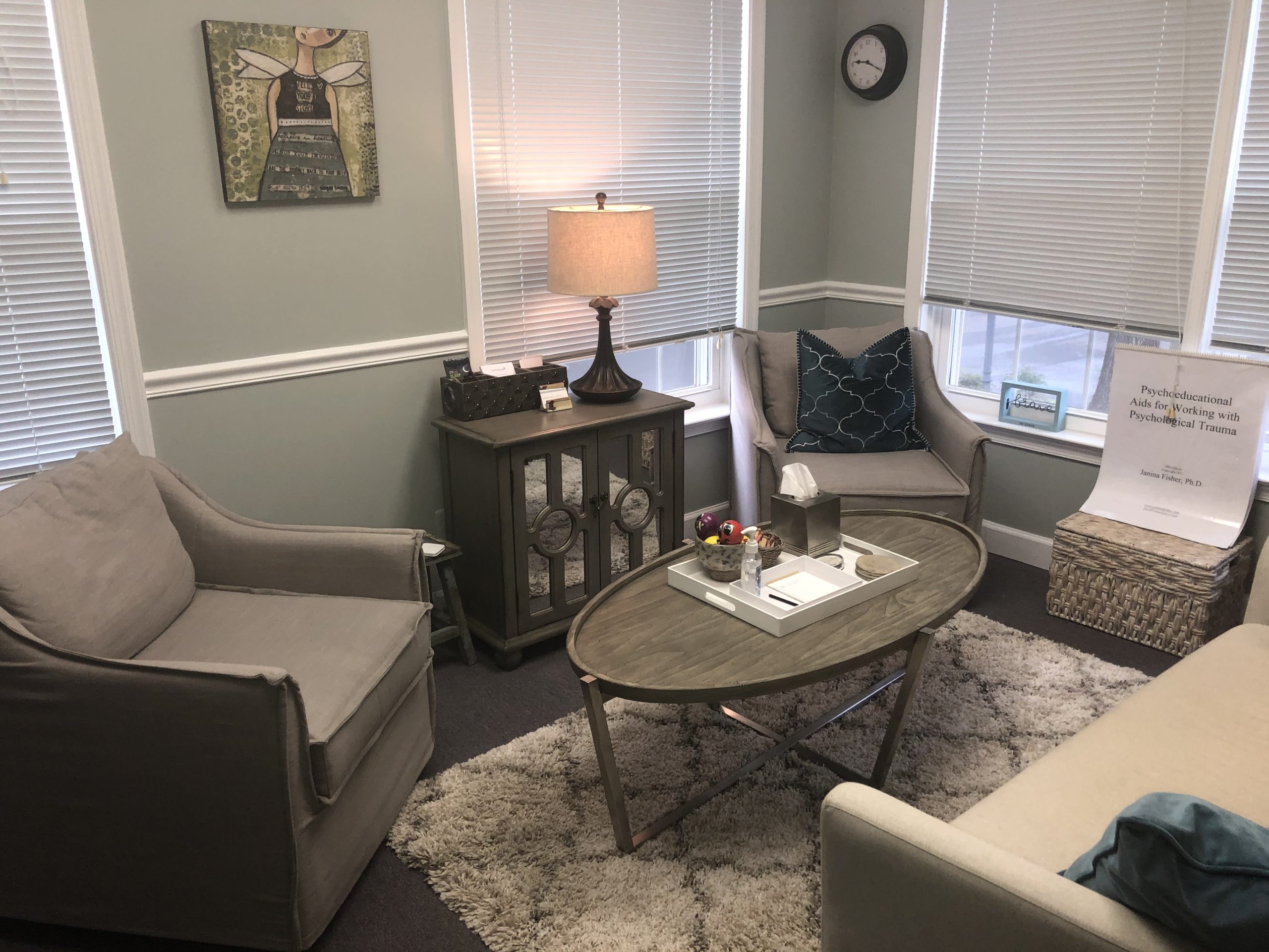 Interior of office with couch, chairs, and table